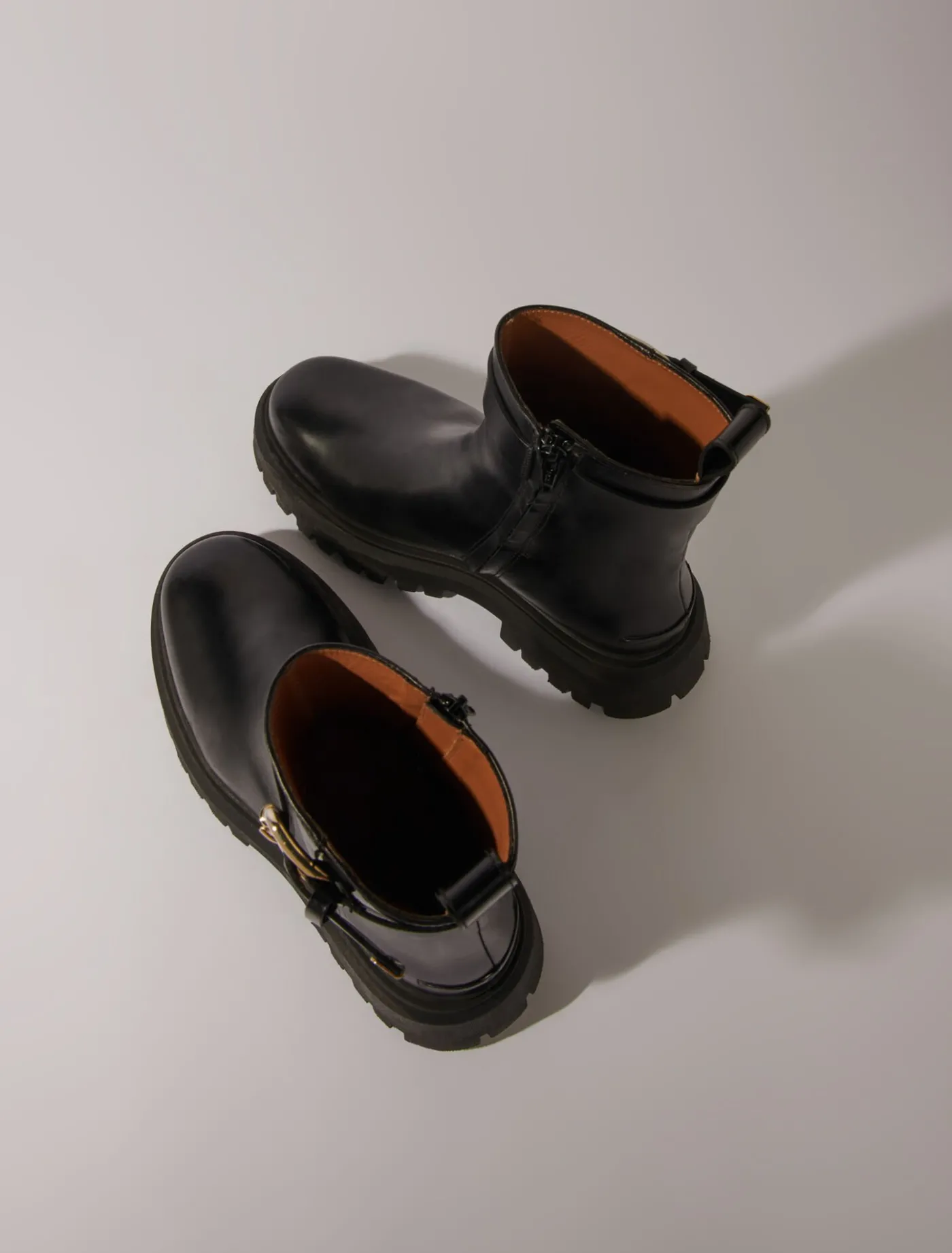 leather_ankle_boots_with_buckles_4.webp Leather ankle boots with buckles^Maje Discount